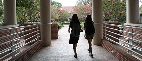 Students walking out of Swem Library