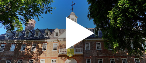 Upward view of the historic Wren Building with a triangular icon overlayed