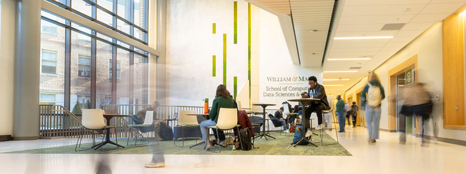 A slow exposure indicating students moving through the new ISC4 atrium while other students study at tables.