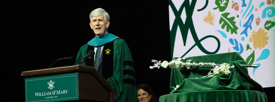 Former Rector Todd A. Stottlemyer ’85, P ’16, P ’21 speaks at a William &amp; Mary podium on stage at Kaplan Arena