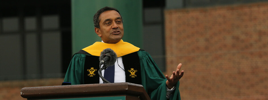 Conservation International CEO M. Sanjayan speaks to graduates from a podium